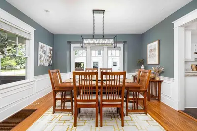 a dining room with a table and chairs at The Craftsman Uptown - Walk to Shops & Eats in Perrysburg