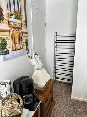 a kitchen with a coffee maker on top of a counter at Comfortable King Bedroom within A HOME WITH HOSTS in Columbus