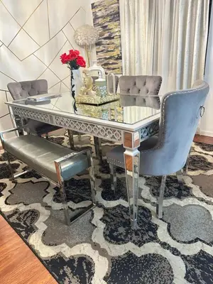 a dining room table and chairs with a glass top at Comfortable King Bedroom within A HOME WITH HOSTS in Columbus