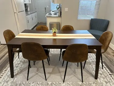 a dining room table and chairs in a kitchen at Lovely 2BR Near Downtown Area in Columbus
