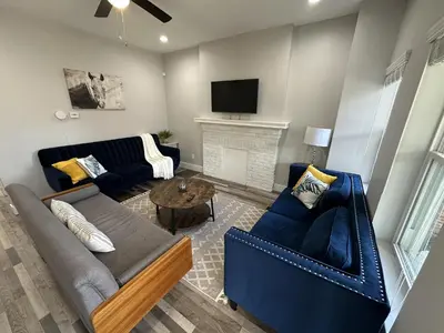 a living room with a couch and a fireplace at Lovely 2BR Near Downtown Area in Columbus
