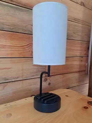 a black lamp sitting on top of a wooden table at Hocking Hills Cabin, Hot Tub, Private Pond in McArthur