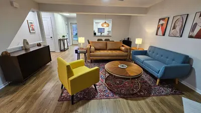 a living room with a couch and a table and chairs at North Columbus Townhouse - Central, Updated, Fireplace in Columbus