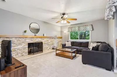 a living room with a couch and a fireplace at CVNP Winter Getaway - 5 mins to Boston Mills Ski in Northfield