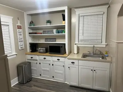 a kitchen with a sink and a microwave at The Perazim in Akron