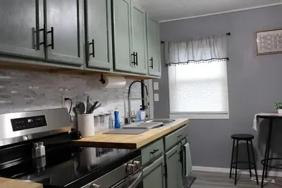 a kitchen with a sink and a counter top at HiddenJewel in Springfield