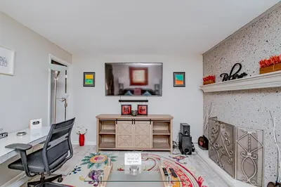 a room with a desk and a chair and a mirror at Lovely Eclectic Duplex - Peaceful Neighborhood in Trotwood