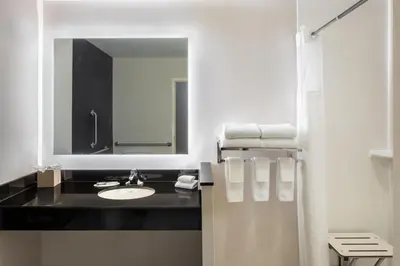 a bathroom with a sink and a mirror at Fairfield Inn & Suites by Marriott Columbus Dublin in Dublin