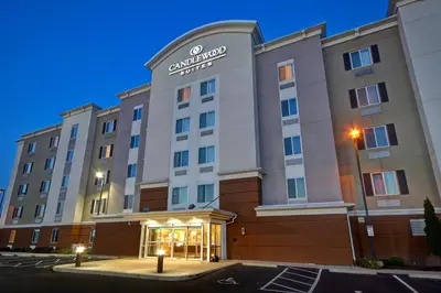 a rendering of a hotel at night at Candlewood Suites St Clairsville Wheeling Area by IHG in Saint Clairsville