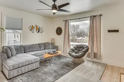 a living room with a couch and a chair at 3 Mi to Downtown Youngstown Updated Apartment in Youngstown