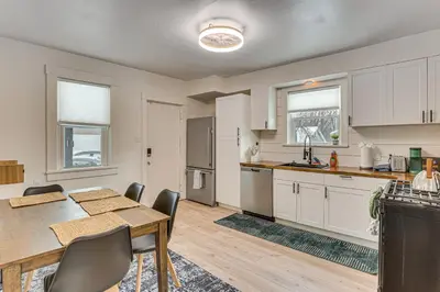a kitchen and dining room with a table and chairs at 3 Mi to Downtown Youngstown Updated Apartment in Youngstown