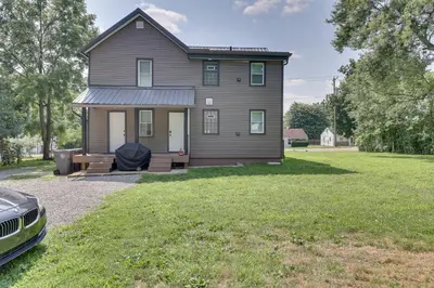 a house with a car parked in front of it at 3 Mi to Downtown Youngstown Updated Apartment in Youngstown