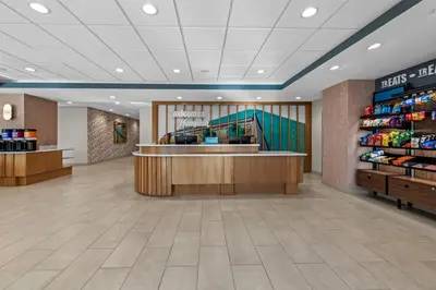 a lobby of a store with a counter and a pharmacy at Hampton Inn Mt. Vernon Oh in Academia