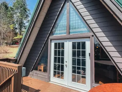 a front door of a house with a window at Edgewater Escape, Hocking Hills, Hot Tub, Pond in Rockbridge