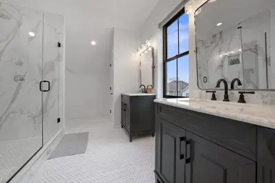 a bathroom with two sinks and a shower and a mirror at Jungle House Luxury Homes - Columbus Downtown Short North - Near Convention Center & Nationwide Arena - Sleeps up to 15 - Free Parking - Over 5,800 Five Stars in Columbus