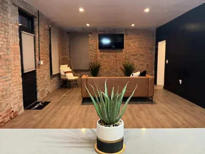 a plant sitting on a table in a room at Jungle House Luxury Stays - Columbus Downtown Short North in Columbus