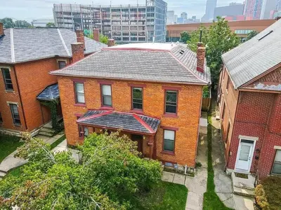 an aerial view of a brick house in a city at Jungle House Luxury Stays - Columbus Downtown Short North in Columbus