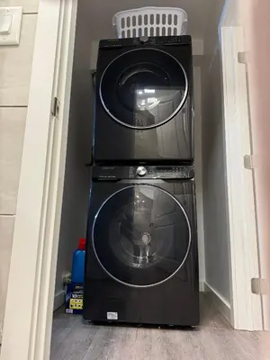 two microwaves stacked on top of each other at Jungle House Luxury Stays - Columbus Downtown Short North in Columbus