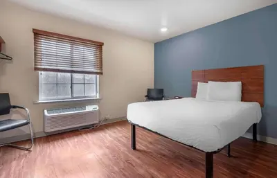a bedroom with a large bed and a window at Extended Stay America Select Suites - Dayton - Miamisburg in Dayton