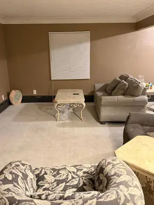 a living room with a couch and a coffee table at The Unity Hub in Toledo