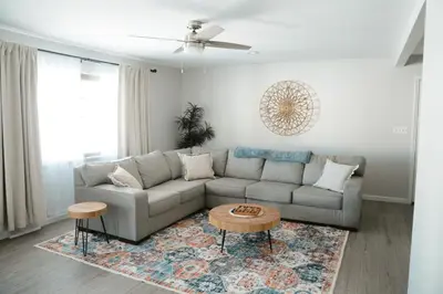 a living room with a couch and a table at Mid Ohio Comfort 10 Minutes From Snow Trails in Lexington