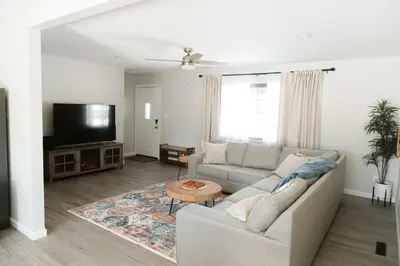 a living room with a couch and a tv at Mid Ohio Comfort 10 Minutes From Snow Trails in Lexington