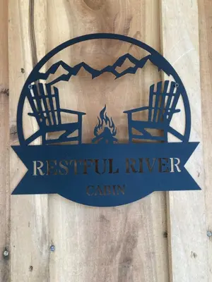 a sign for a restaurant with two chairs and a fire at Restful River Cabin, Red River Gorge, KY, River Access & Views in Stanton