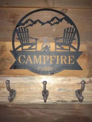 a sign for a campfire cabin with two chairs at Campfire Cabin, Red River Gorge, KY, River Access & Views in Stanton