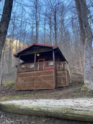 a small cabin in the middle of the woods at Sleepy Bear Cabin, Red River Gorge, KY, River Access & Views in Stanton
