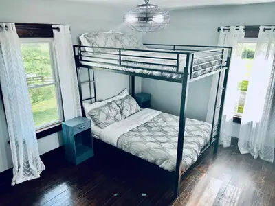 a bedroom with two bunk beds in a room at Scippo Creek Farm in Circleville