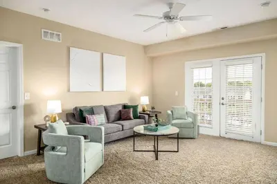 a living room with a couch and two chairs at The New Albany Perch Top Floor Pet-Friendly! in Westerville
