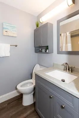 a bathroom with a sink and a toilet at Upgraded Downtown Apartment Sleeps 5 in Sandusky