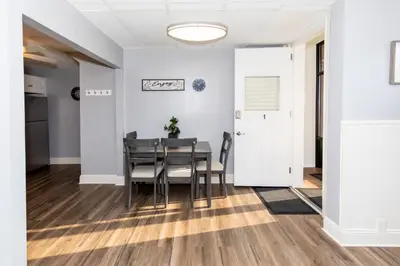 a dining room with a table and chairs at Upgraded Downtown Apartment Sleeps 5 in Sandusky