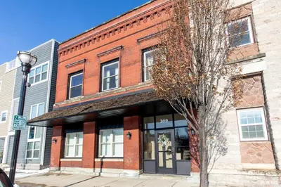 a red brick building on a city street at NEW! Remodeled & Upgraded Vacation Apartment in Sandusky