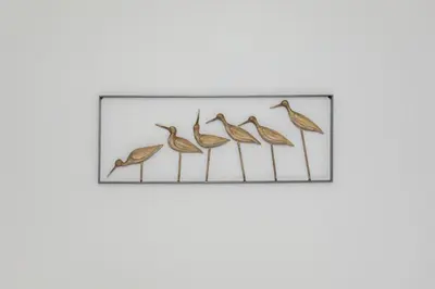four birds on a wire metal wall art at NEW! Remodeled & Upgraded Vacation Apartment in Sandusky