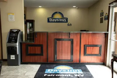 a day inn restaurant with a sign on the wall at Days Inn by Wyndham Fairmont in Fairmont
