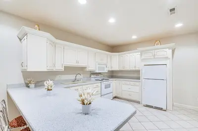 a kitchen with white cabinets and a white counter top at 6 Mi to Town Peaceful Lima Home! in Lima
