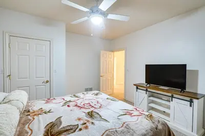 a bedroom with a bed and a flat screen tv at 6 Mi to Town Peaceful Lima Home! in Lima