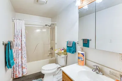 a bathroom with a toilet and a sink at 6 Mi to Town Peaceful Lima Home! in Lima