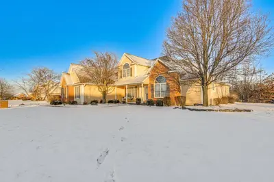 a house with a lot of snow in the yard at 6 Mi to Town Peaceful Lima Home! in Lima