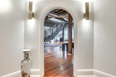 a vase sitting in a hallway with an archway at Less Than 1 Mi to Wittenberg Eclectic Loft with Parking! in Springfield