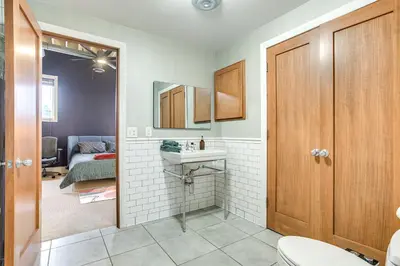 a bathroom with a toilet and a sink at Less Than 1 Mi to Wittenberg Eclectic Loft with Parking! in Springfield