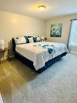 a bedroom with a bed and a window at Overbrook Delight -tranquil stay for day and night in Monroe
