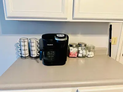 a coffee maker on a counter in a kitchen at Overbrook Delight -tranquil stay for day and night in Monroe