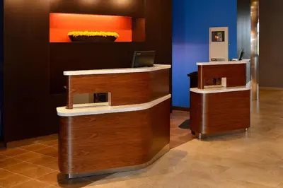 a lobby with a desk with a laptop on it at Courtyard by Marriott Youngstown Canfield in Canfield