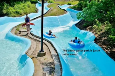a water park with people in boats in a river at Dimmick Cozy Retreat 3 Bed 1 Bath - Sleeps 6 in Gano