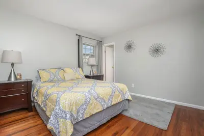 a bedroom with a bed and a window at Ashwood Arbor 6 bed 3 bath sleeps 13 in Olde West Chester