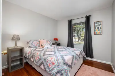 a bedroom with a bed and a window at Ashwood Arbor 6 bed 3 bath sleeps 13 in Olde West Chester