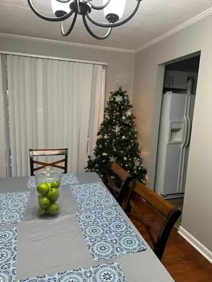 a dining room with a table with a christmas tree at Ashwood Arbor 3 bed 2 bath sleeps 8 in Olde West Chester