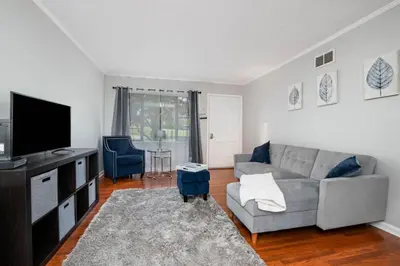 a living room with a couch and a tv at Ashwood Arbor 3 bed 2 bath sleeps 8 in Olde West Chester